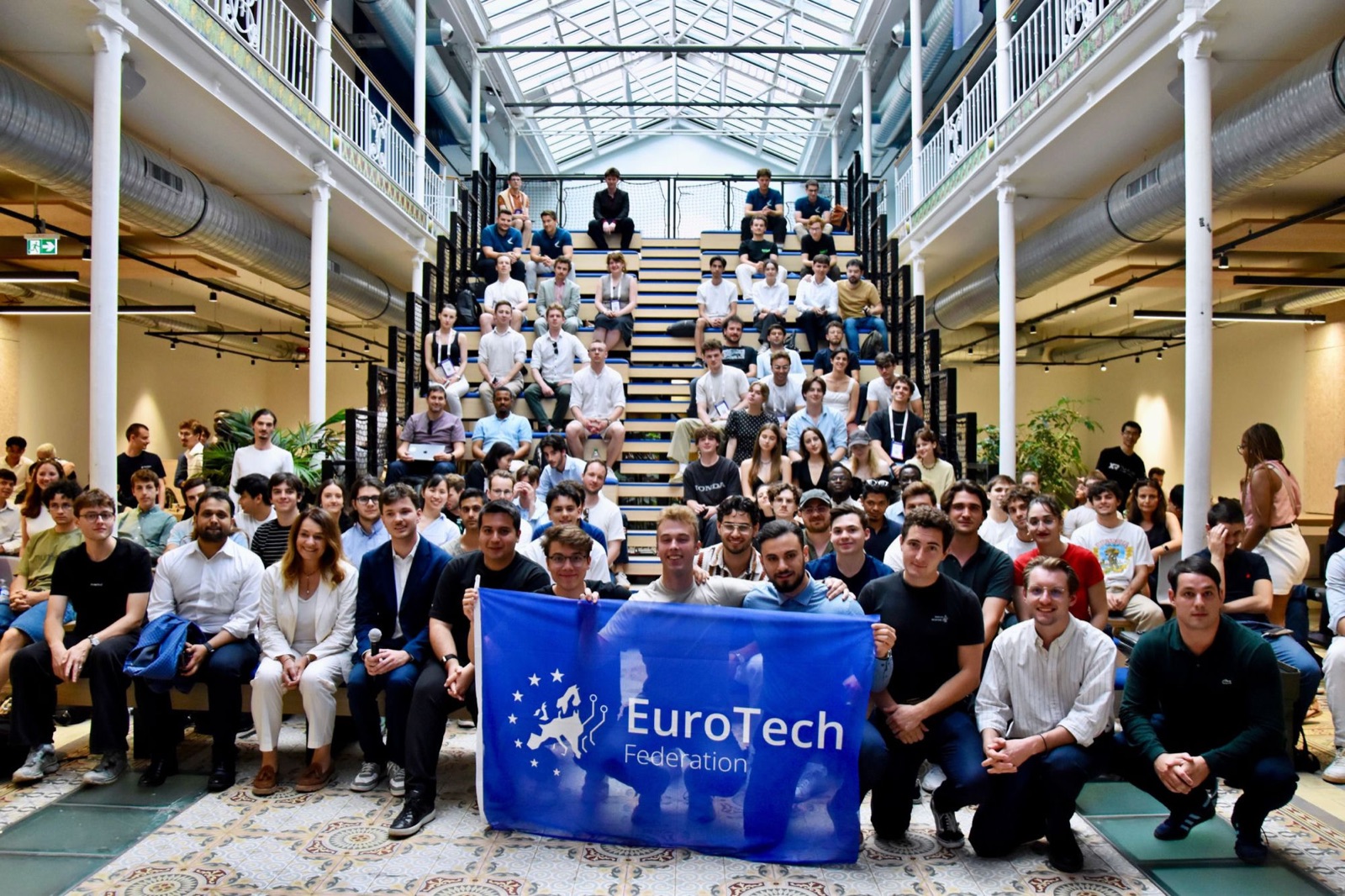 The federation assembled on the summit staircase with the EuroTech flag